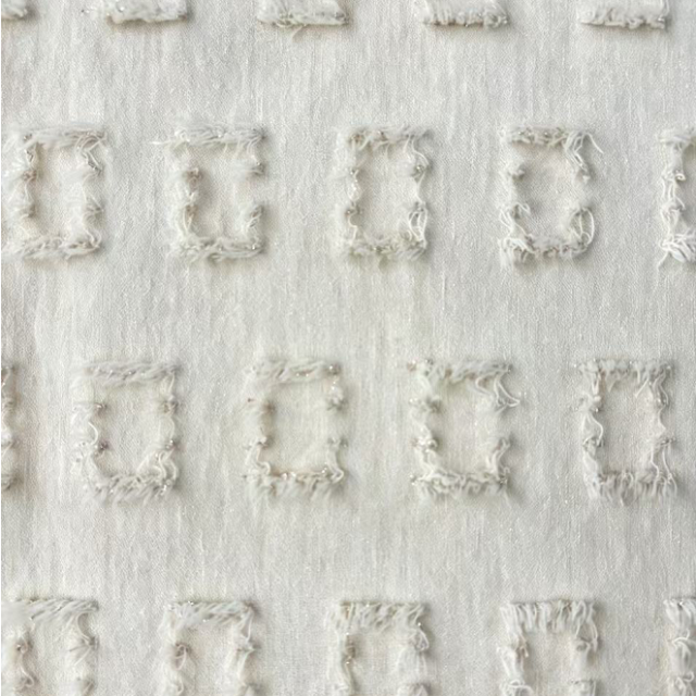 63%POLY 32%R 3%SP 2%M IVORY FRAYED SQUARE CLIP JACQUARD KNIT